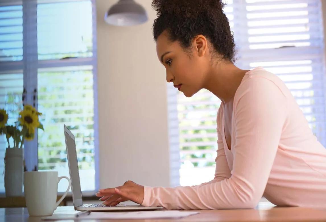 job seeker sitting at a desk while preparing for a healthcare job interview