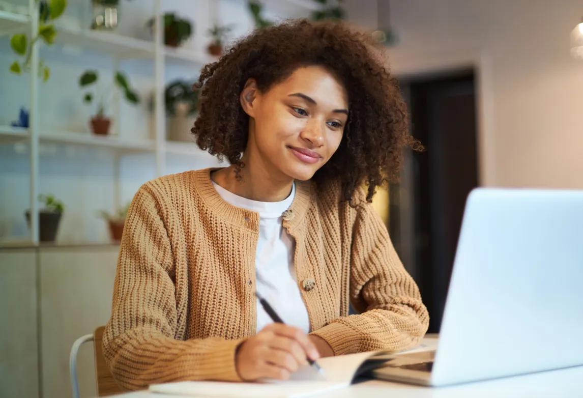 healthcare professional using a laptop to build a personal brand on LinkedIn