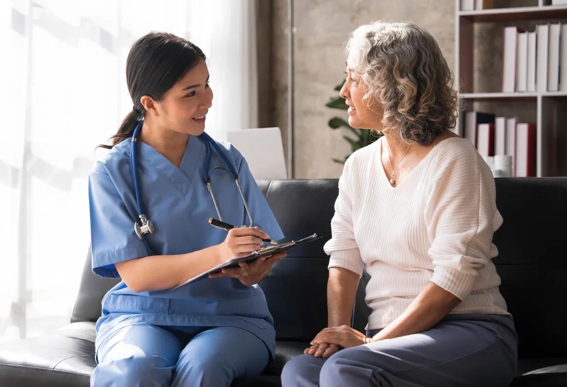 healthcare professional making an sign with their hand as a form of nonverbal communication