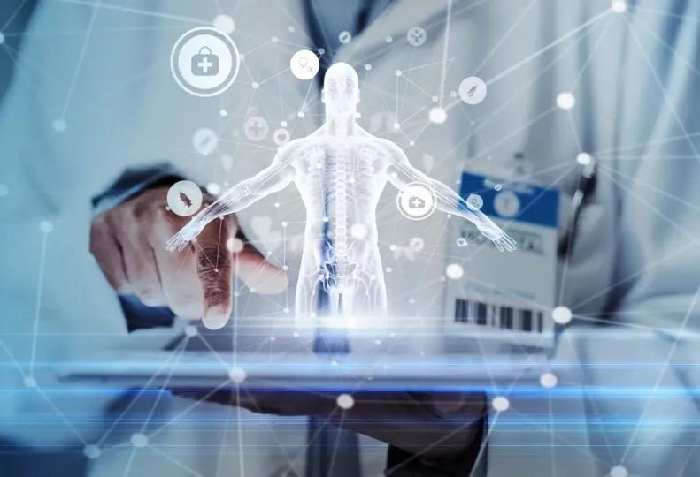 healthcare worker holding a laptop while using artificial intelligence in healthcare