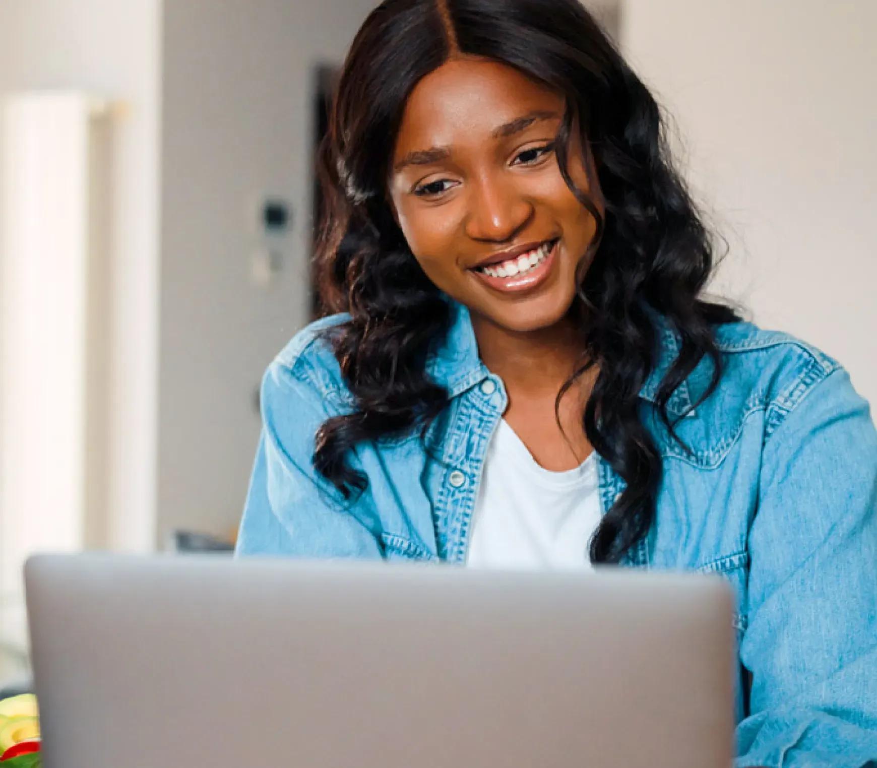 A woman sitting at a computer