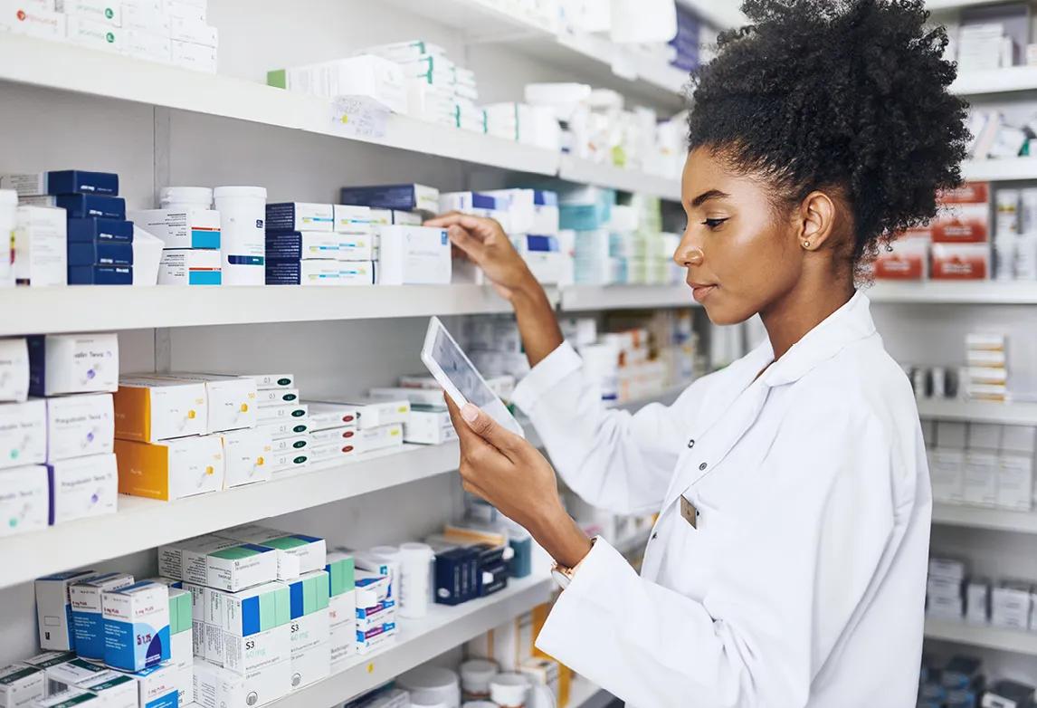 a licensed pharmacy technician checking inventory