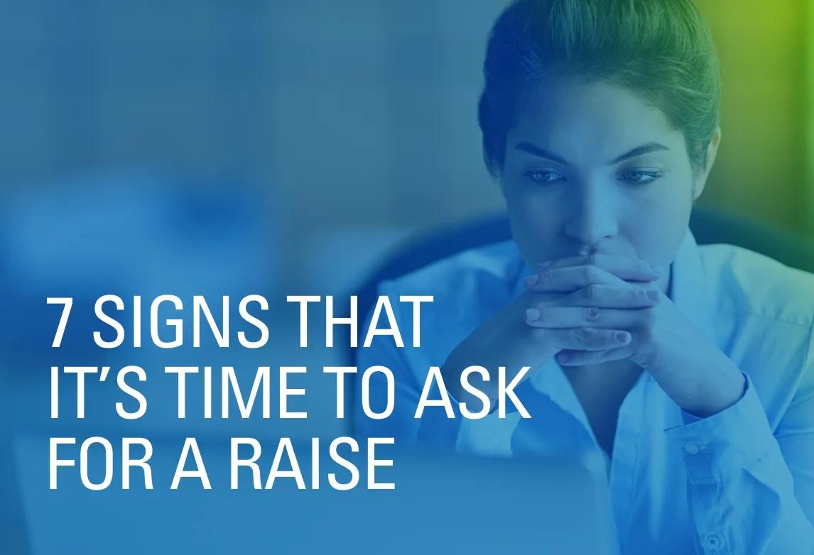 An employee thinks, with hands folded, about the seven signs that it may be time to ask for a raise.