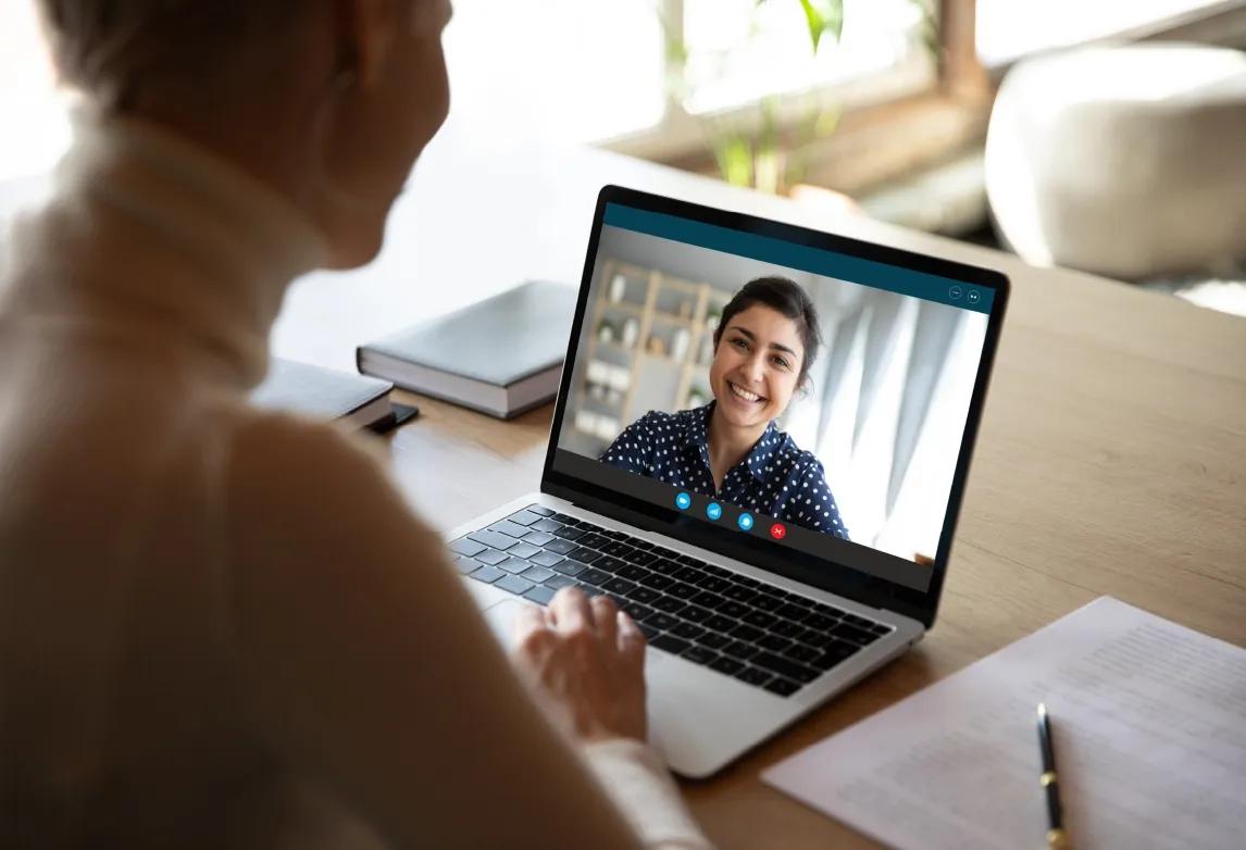 remote healthcare worker talking with a patient on a computer