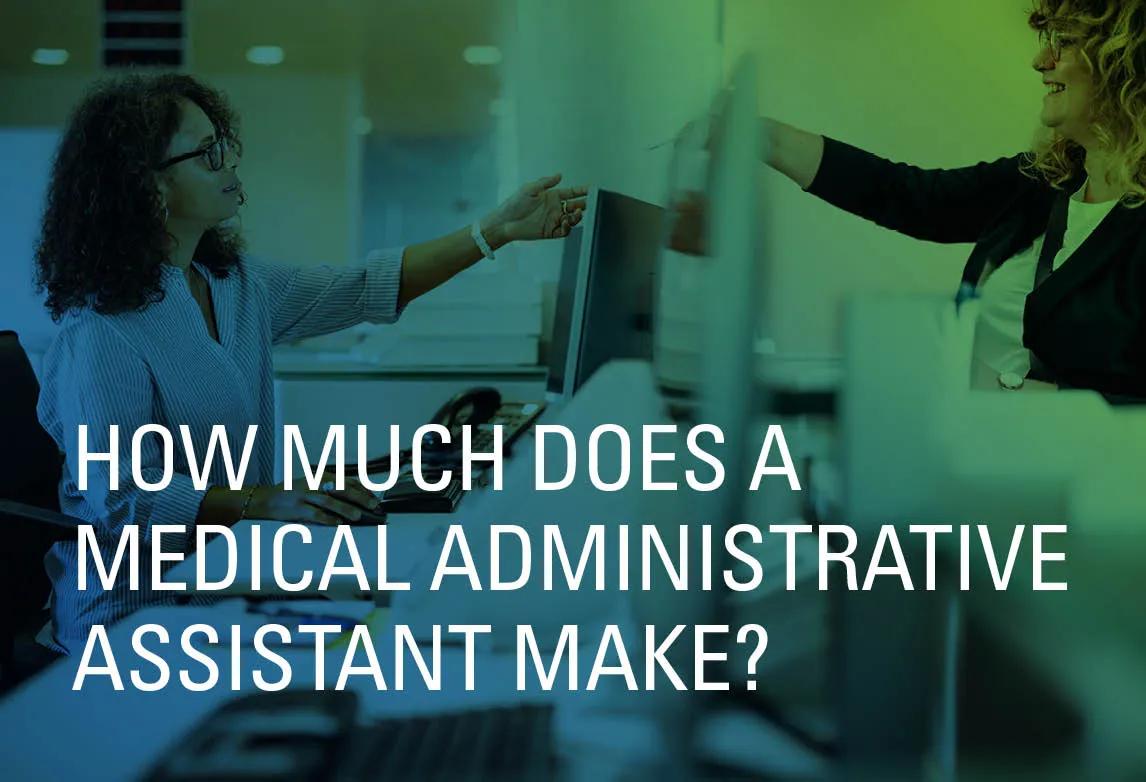 Medical assistant sitting at a reception desk and reaching forward to take an insurance card from a patient.