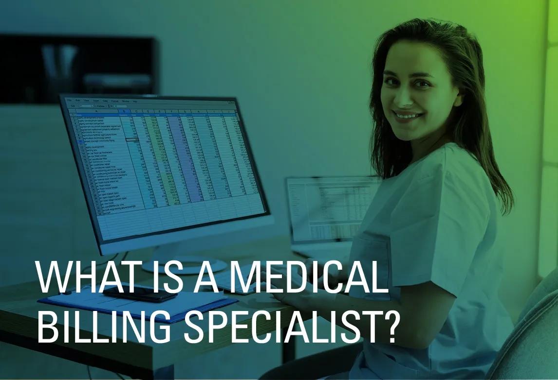 A medical billing specialist works at her desk wearing scrubs.