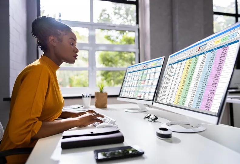 a healthcare worker using her medical billing and coding skills to update a healthcare facility’s records