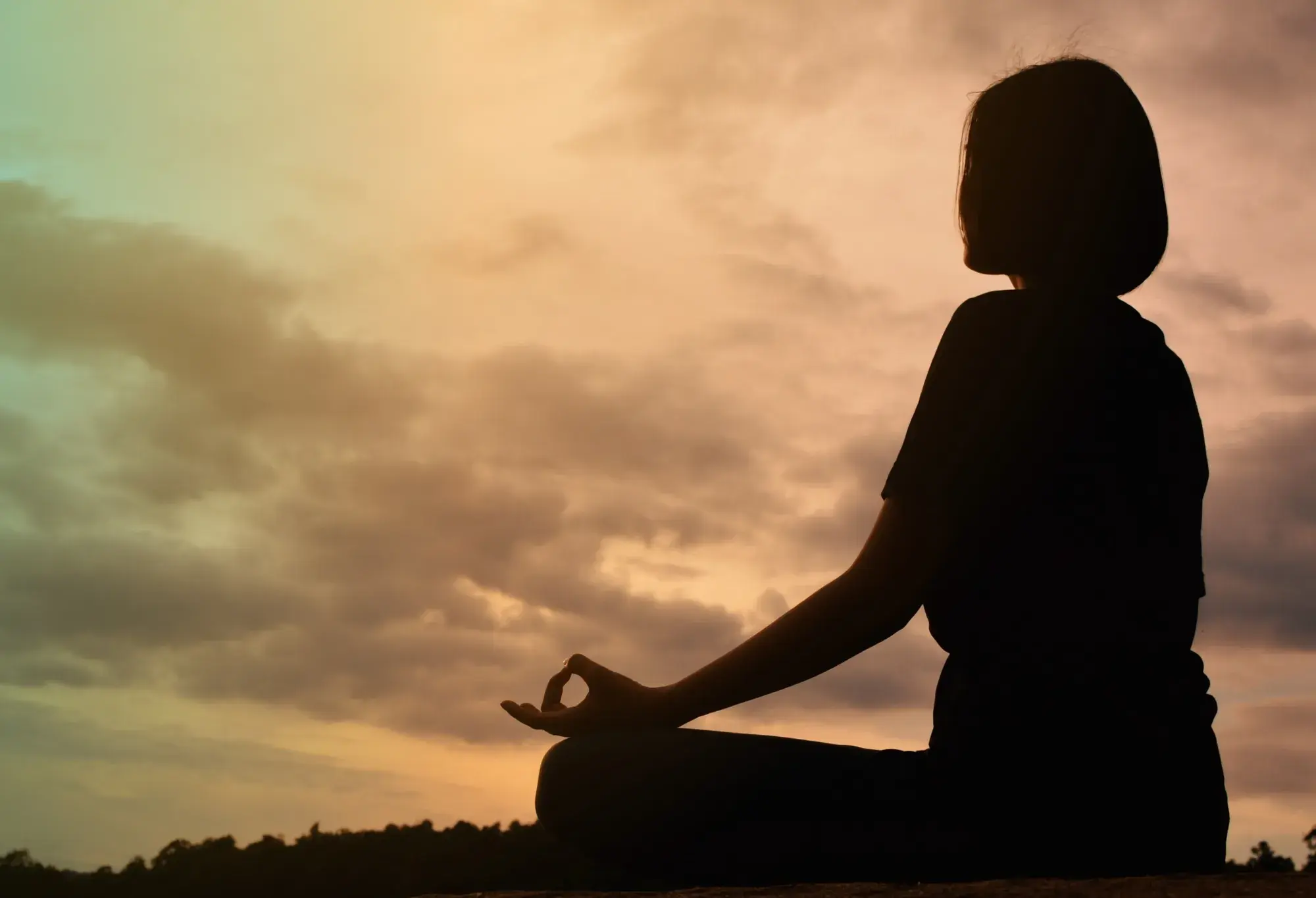 a student practicing yoga for spiritual growth while working toward their healthcare career goal