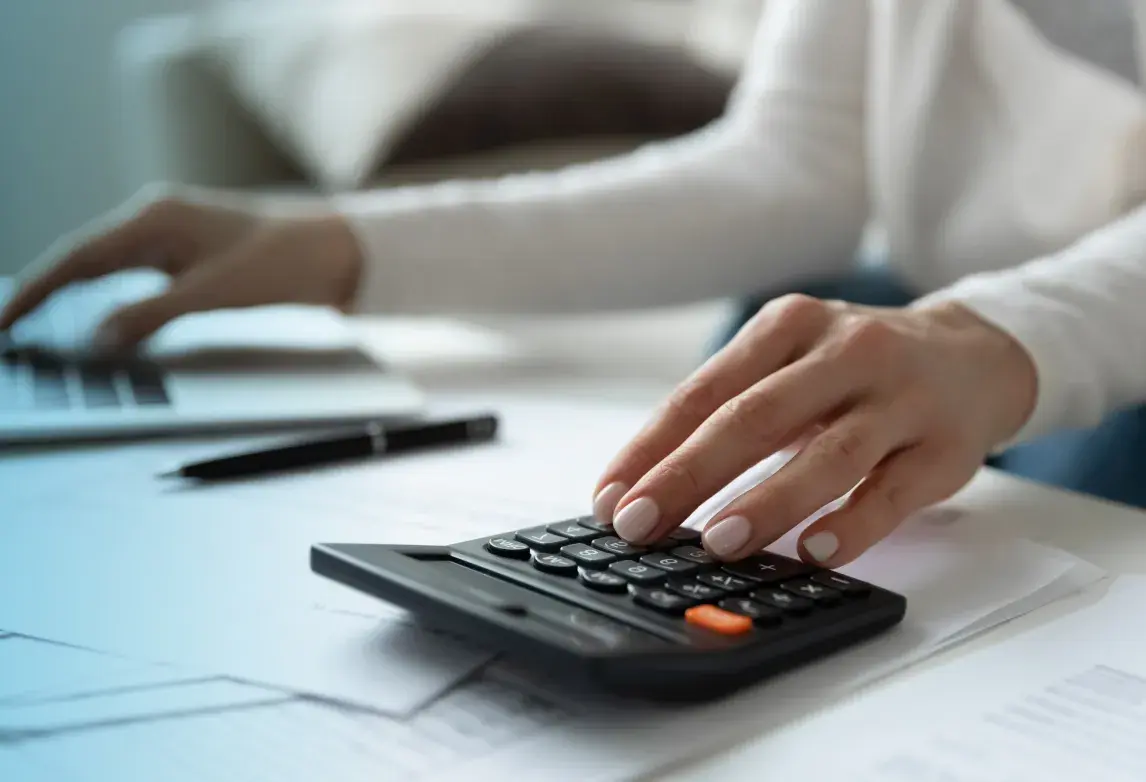a healthcare accounting professional calculating financial figures