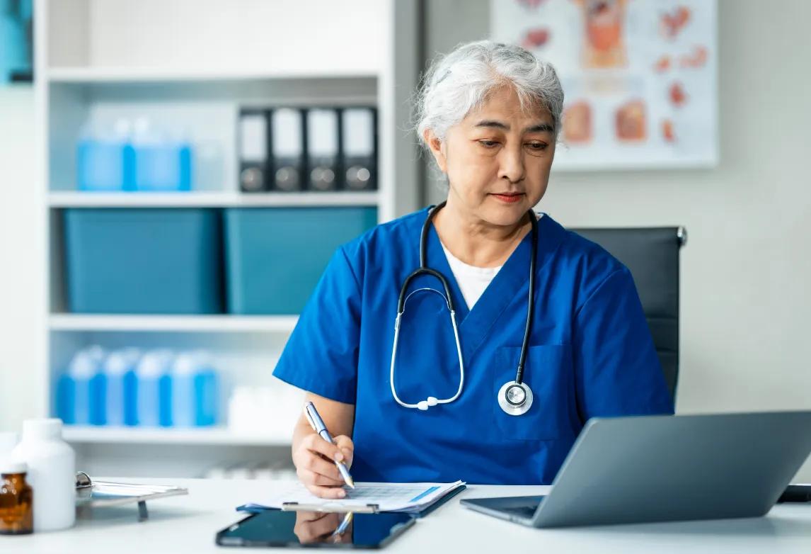 health information technician working in the field after completing health information management training